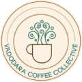 Circular Vadodara Coffee Collective logo featuring a minimalist coffee cup with ornamental steam swirls in teal and brown on a beige background. Badge-style logo for Vadodara Coffee Collective with concentric circles, curved typography, and an abstract steaming coffee cup illustration. Minimal café community logo showing a stylized coffee cup with decorative swirling steam inside a circular seal reading “Vadodara Coffee Collective.” Elegant line-art logo in earthy tones featuring a coffee mug and artistic steam patterns surrounded by circular typography for Vadodara Coffee Collective. Round coffee collective emblem with modern typography and whimsical steam illustration rising from a minimalist cup.